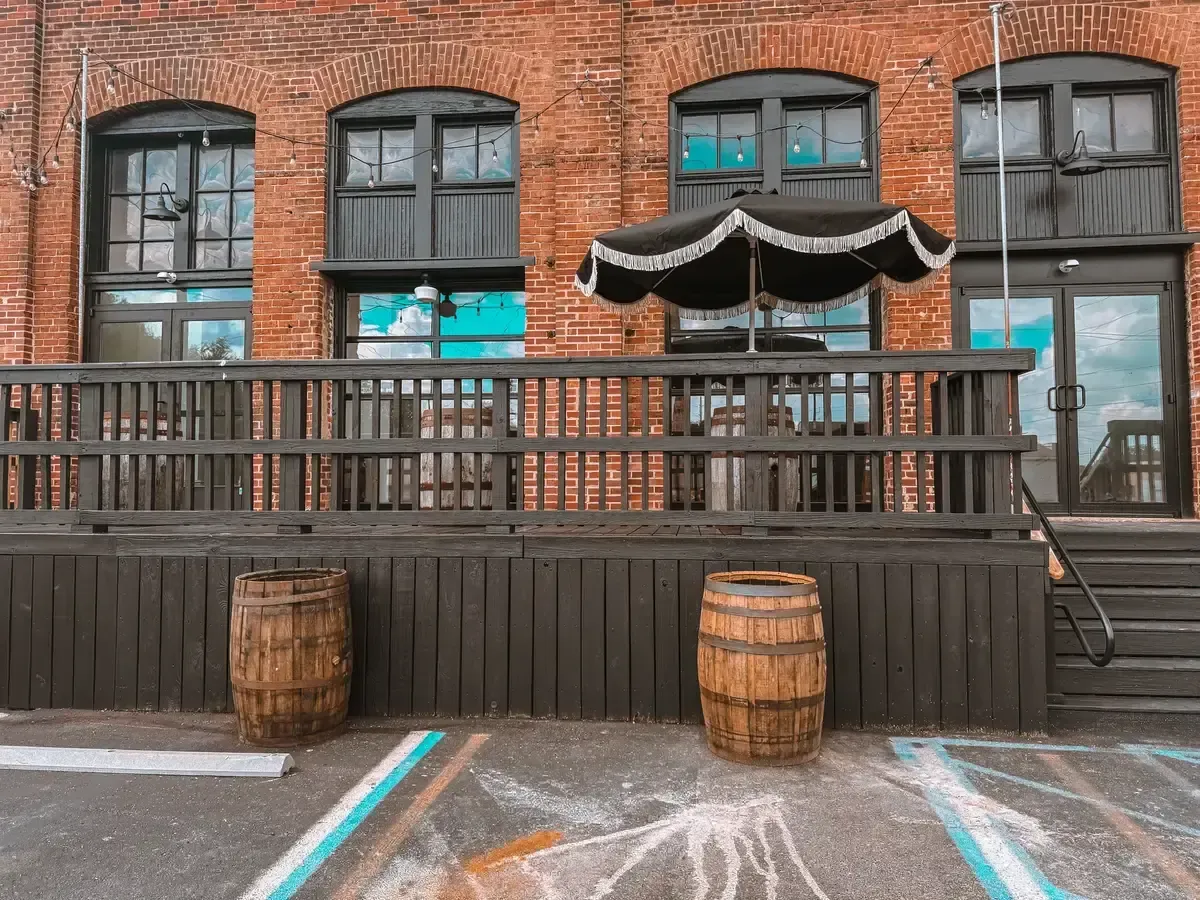 Guests gathered on the Prohibition Patio at 24 Shelby in downtown Indianapolis with string lights overhead, the kind of relaxed celebration newly engaged couples should focus on instead of sweating small details