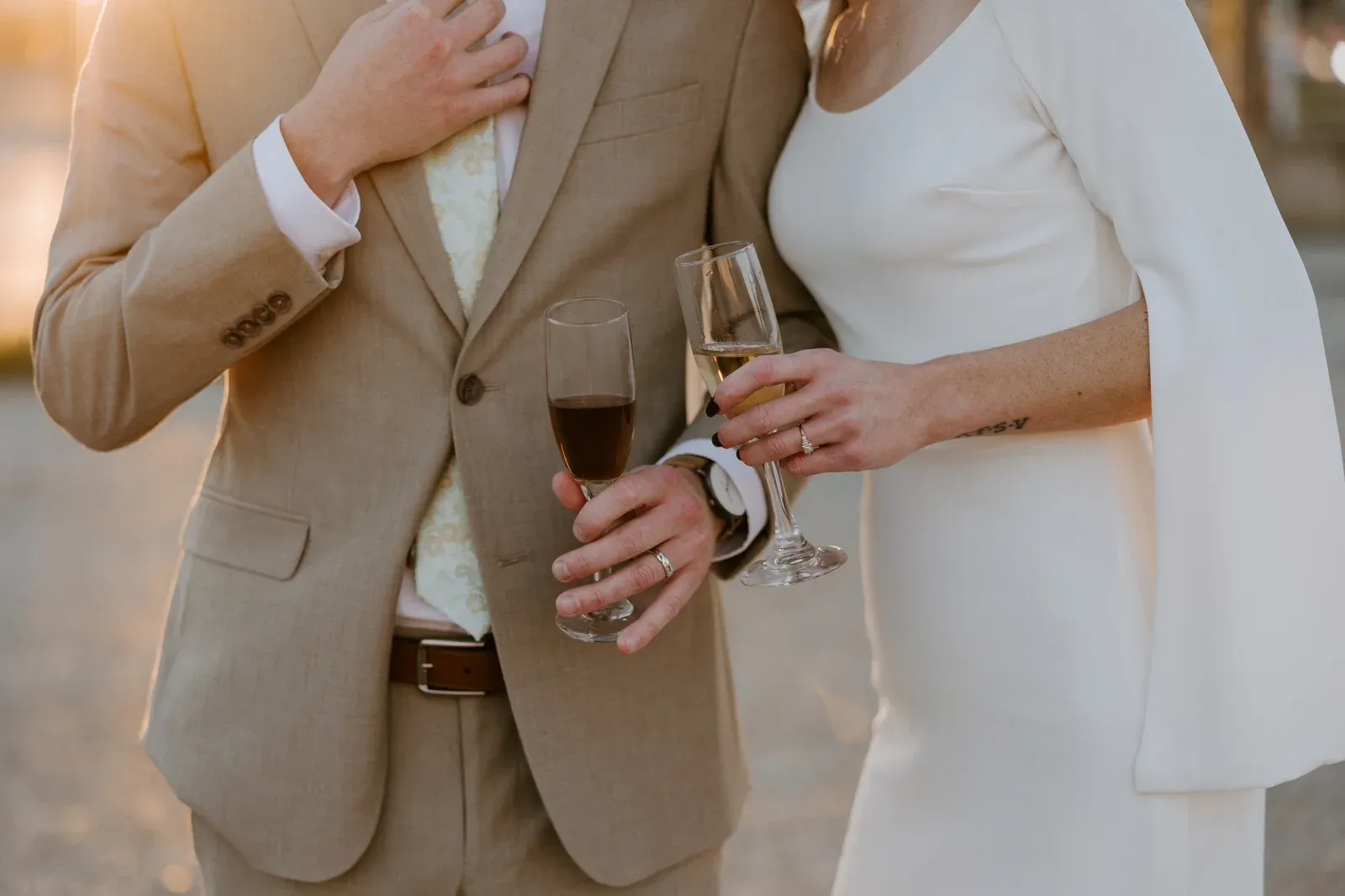 A champagne toast at 24 Shelby, coupe glasses raised under the historic brick of the only surviving pre-Prohibition brewery building in Indianapolis